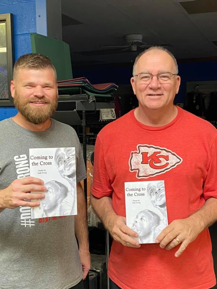 Reader holding Seth Irving's book